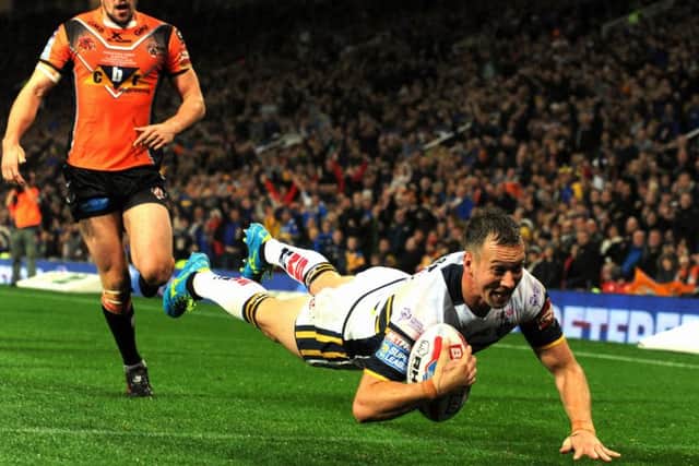 Danny McGuire dives in for the Rhinos' second try of the 
Super League Grand Final to break the hearts of Castleford Tigers. (Picture: Bruce Rollinson)