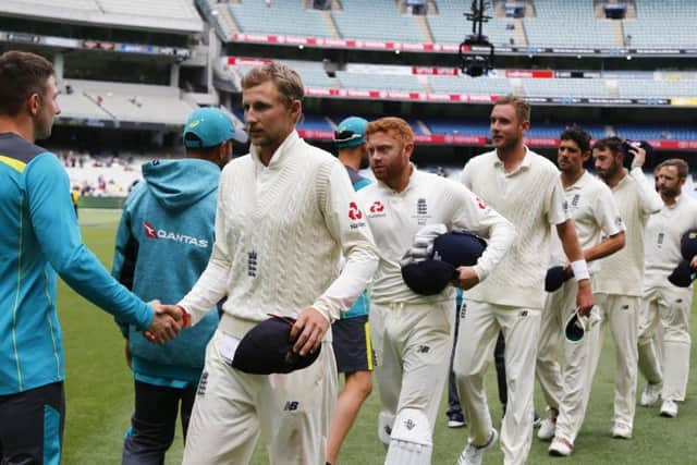 England's Joe Root and Jonny Bairstow shake hands with Australian players after a draw at the MCG. Picture: Jason O'Brien/PA