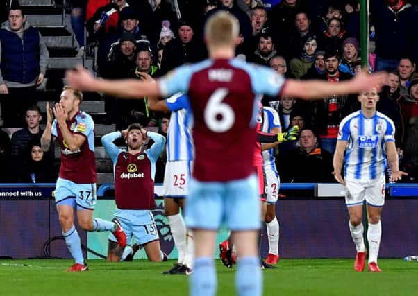 Burnley players appeal for a penalty after Burnley's Jeff Hendrick (centre) is brought down in the area during the Premier League match at John Smith's Stadium, Huddersfield. (Picture: PA)