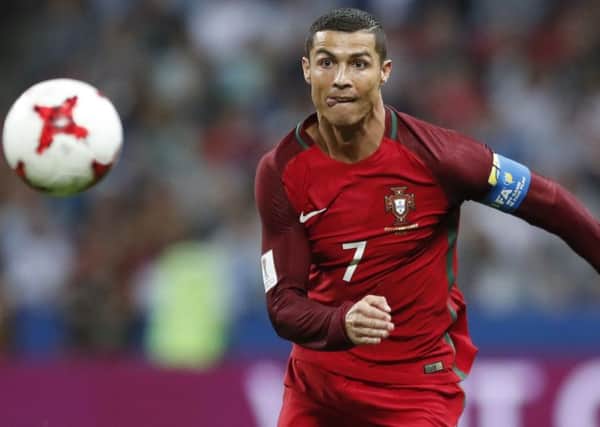 Portugal's Cristiano Ronaldo keeps his eyes on the ball during the Confederations Cup. (AP Photo/Pavel Golovkin)