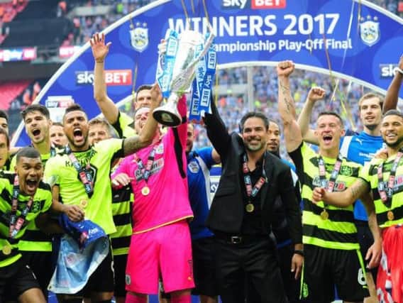 GRAND DAY OUT: Huddersfield Town manager David Wagner celebrates with his players after clinching promotion to the Premier League at Wembley in May 2017. Picture: Simon Hulme.