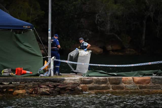 Debris from the crash is pulled from the Hawkesbury River