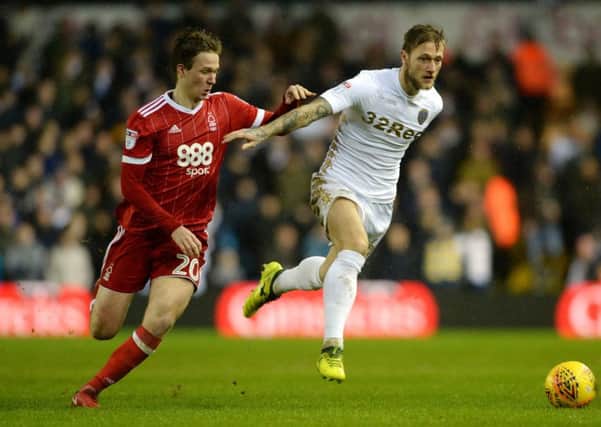 Leeds United's Liam Cooper gets clear of Nottingham Forest's Kieran Dowell.