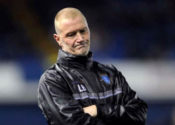 Sheffield Wednesday's stand-in manager Lee Bullen shows his dejection on the sidelines during the Owls' 3-0 defeat to Burton Albion (Picture: Steve Ellis).