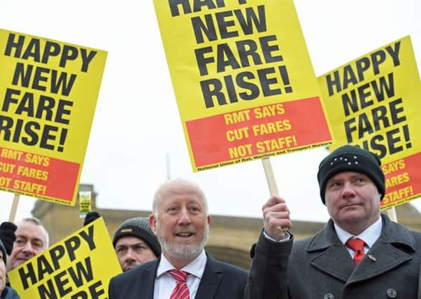 Shadow Transport Secretary Andy McDonald (centre) joins campaigners protesting against rail fare increases outside King's Cross station in London. PRESS ASSOCIATION Photo. Picture date: Tuesday January 2, 2018. See PA story RAIL Fares. Photo credit should read: Stefan Rousseau/PA Wire