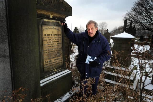 Artist Maxwell Doig admires poet Tony Harrison, pictured here at his parent's grave in Holbeck Cemetery in Leeds.