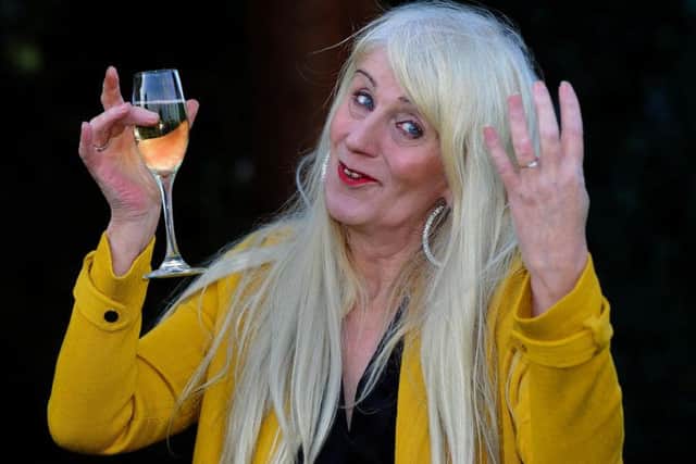 Taxi driver Melissa Ede, 57, celebrating during a photocall at Willerby Manor Hotel in Hull after her 4m Scratchcard win on New Year's Day. PA