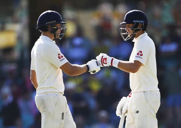 England's Joe Root and Dawid Malan complment each other during day one of the final Ashes Test at the SCG. Picture: Jason O'Brien/PA