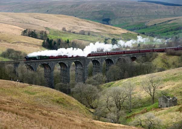 The Flying Scotsman crossing the Dent Head Viaduct on its return journey from Carlisle to Oxenhope to celebrate the re-opening of the Settle Carlisle Railway line in March last year.  Picture by Bruce Rollinson.