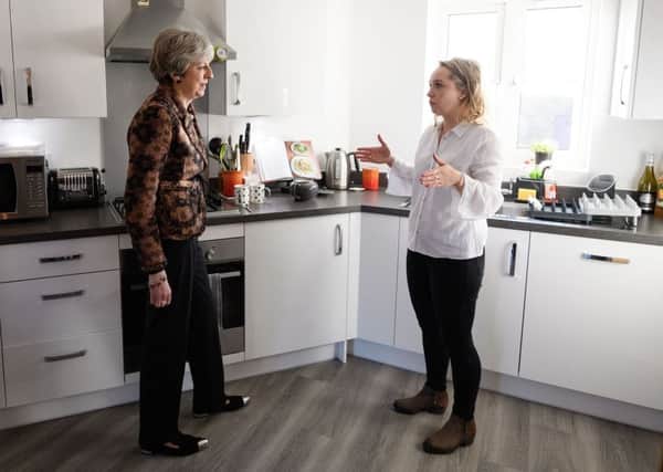 Prime Minister Theresa May (left) chats with first-time buyer Laura Paine during a visit to new housing development Montague Park in Wokingham last week to highlight the Government's housing reforms.