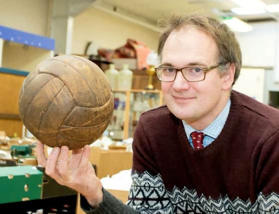 Charles Hanson with the FA Cup hat-trick football.  Picture: SWNS