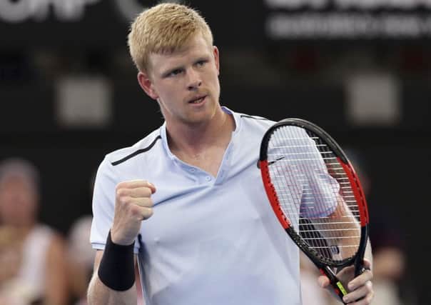 Kyle Edmund of Britain reacts after winning a point in his match against Denis Shapovalov of Canada during the Brisbane International tennis tournament. (AP Photo/Tertius Pickard)