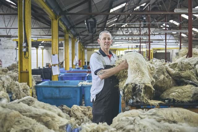One of the Bradford wool workers treating the batches of fleece. CREDIT @withloveproject