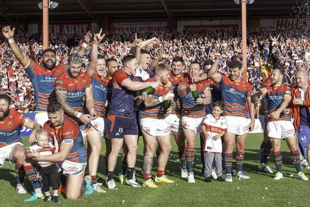 Hull KR celebrate victory after they regain their place in Super League.