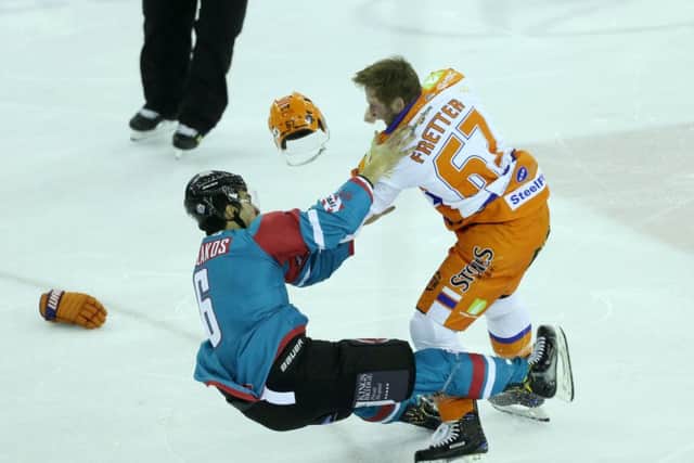 HELLO AGAIN: Belfast Giants Spiro Goulakos and Sheffield Steelers Colton Fretter drop their gloves early on in Friday night's Elite League clash at the SSE Arena. Picture: Press Eye/Darren Kidd
/EIHL.