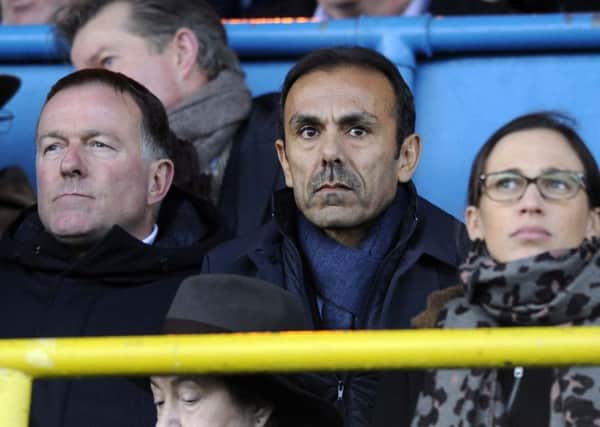 Watching brief:  Jos Luhukay watches from the stands sat between coach Remy Reynierse and Owls chief executive Katrien Meire. Picture: Steve Ellis