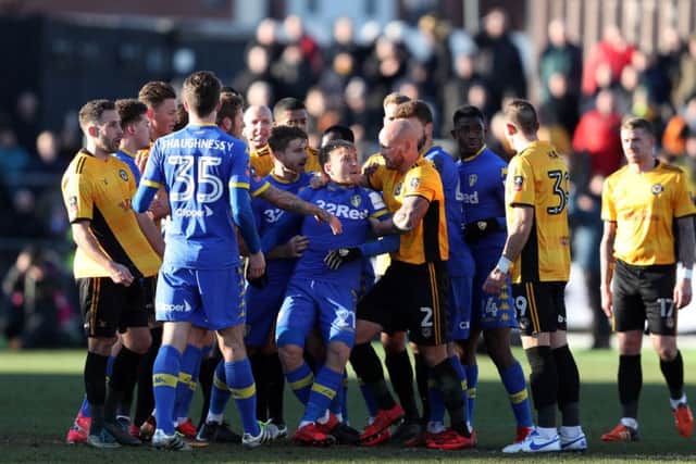 FLASHPOINT: Tempers flare between the two sides resulting in Leeds United's Samuel Saiz (no. 21) being sent off at Rodney Parade. Picture: David Davies/PA