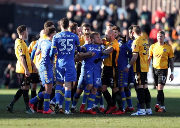 Tempers flare between the two sides resulting in Leeds United's Samuel Saiz (no. 21) being sent off during the Emirates FA Cup, Third Round match at Rodney Parade, Newport. PRESS ASSOCIATION Photo. Picture date: Sunday January 7, 2018. See PA story SOCCER Newport. Photo credit should read: David Davies/PA Wire. RESTRICTIONS: EDITORIAL USE ONLY No use with unauthorised audio, video, data, fixture lists, club/league logos or "live" services. Online in-match use limited to 75 images, no video emulation. No use in betting, games or single club/league/player publications.