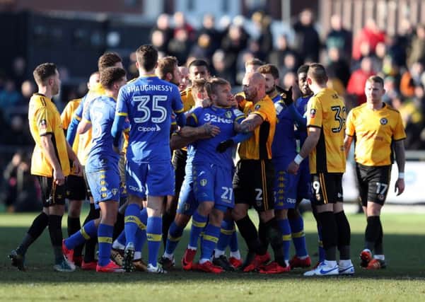 Tempers flare between the two sides resulting in Leeds United's Samuel Saiz (No 21) being sent off at Rodney Parade. Picture: David Davies/PA
