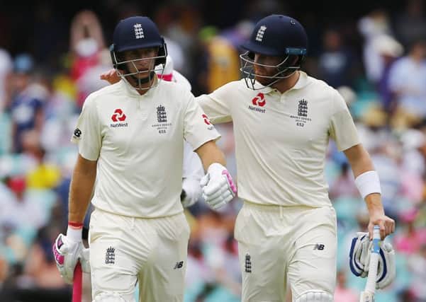 End of the tour: England's Joe Root and Jonny Bairstow walk off at lunch with the captain unable to resume after the break due to illness.