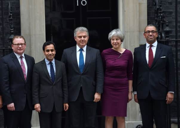 Theresa May is flanked by some of the Conservative Party's new senior lieutenants following the reshuffle.