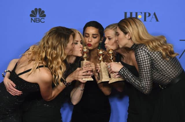 Laura Dern, from left, Nicole Kidman, Zoe Kravitz, Reese Witherspoon and Shailene Woodley pose in the press room with the award for best television limited series or motion picture made for television for "Big Little Lies" at the 75th annual Golden Globe Awards at the Beverly Hilton Hotel