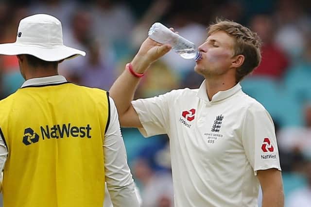 SUFFERING: England ill captain Joe Root takes a drink on day five at the SCG as England head to a 4-0 series defeat. Picture: Jason O'Brien/PA