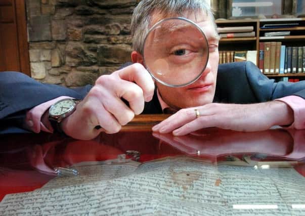 Broadcaster Jeremy Vine viewing the 1216 copy of the Magna Carta at Durham.