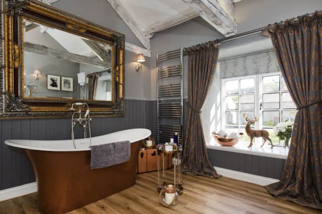Sacrificing a bedroom to create this big, sumptuous bathroom was worthwhile as it is a big hit with guests