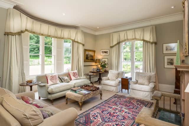 The drawing room with views over the gardens and grounds