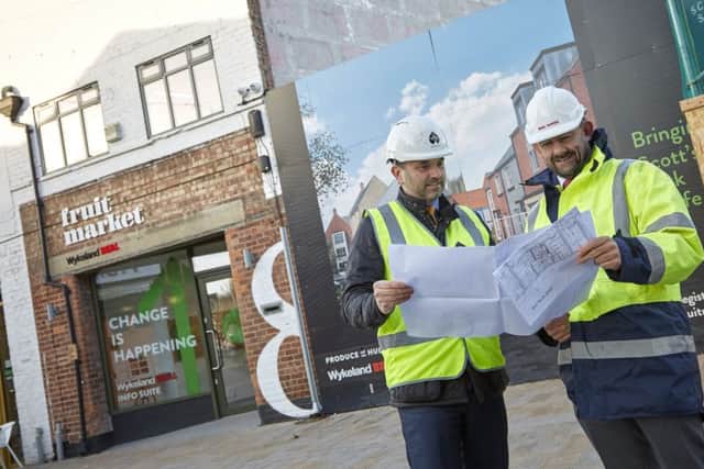 Dominic Gibbons, left, of Wykeland Group, and Richard Beal, from Beal Homes, examine plans for the Â£17m residential development on land behind Humber Street in the heart of the Fruit Market waterside quarter.