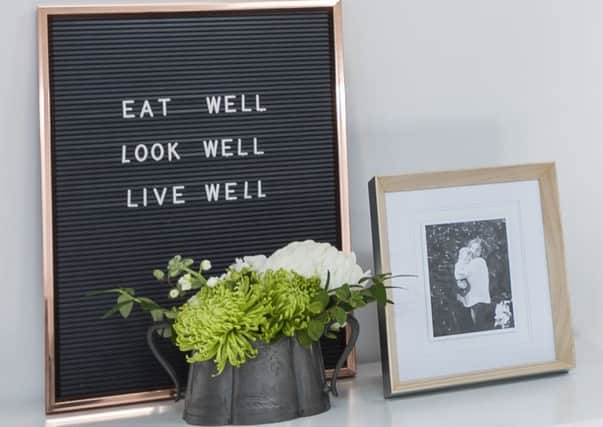 Photographs and motivational quotes make an office feel homely.