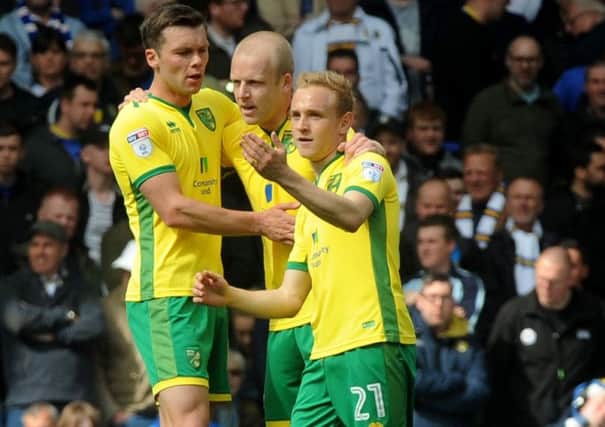 Alex Pritchard, right, pictured celebrating a goal with his Norwich team-mates is poised to join Huddersfield Town (Picture: Andrew Varley)
