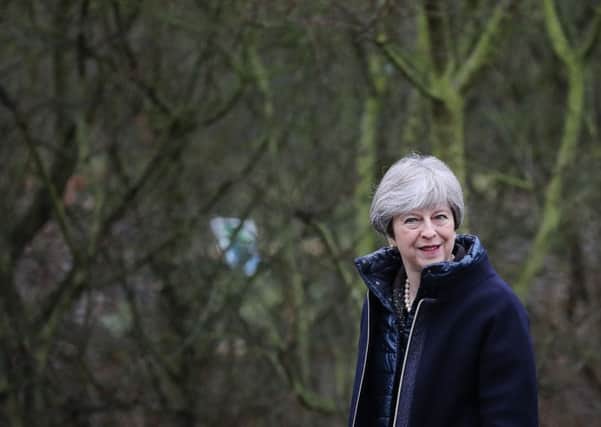 Prime Minister Theresa May walks through the grounds of the Wildfowl and Wetland Trust  ahead of a speech where she set out her vision for protecting the environment. Picture: Dan Kitwood/PA Wire