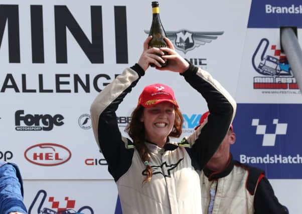 Alice Hughes celebrates a podium finish at Brands Hatch. Picture: Marc Waller
