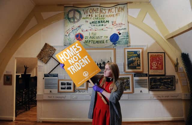 Charlotte Hall, collections and outreach officer at the Peace Museum in Bradford, at the museum's exhibition marking the 60th anniversary of the Campaign for Nuclear Disarmament.