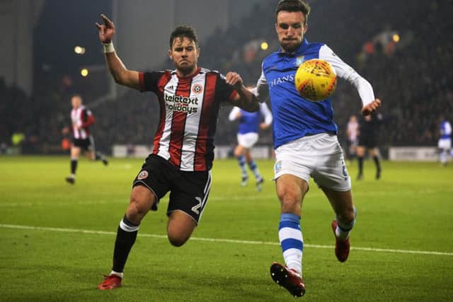 Morgan Fox clears from George Baldock. Picture Bruce Rollinson
