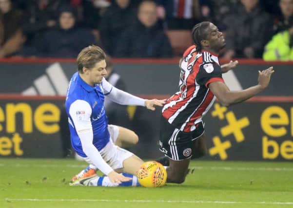 ON YOUR WAY: Sheffield Wednesday's Glenn Loovens (left) fouls Sheffield United's Clayton Donaldson to earn his second yellow card and is sent off at Bramall Lane. Picture: Danny Lawson/PA