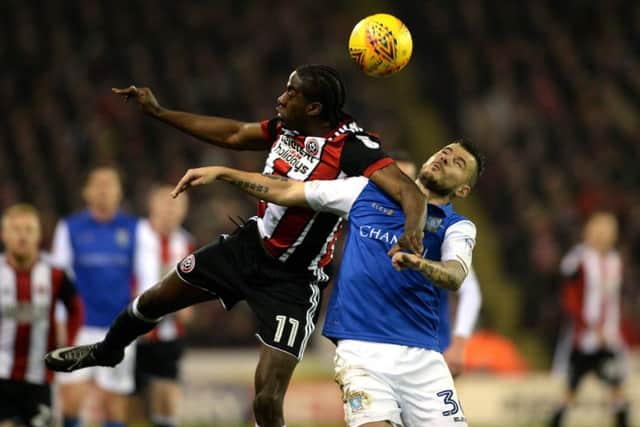 Clayton Donaldson beats Ross Wallace to a high ball.  Picture: Bruce Rollinson