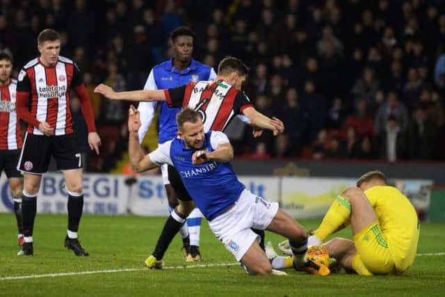 STEAMING IN: Sheffield Wednesday's Jordan Rhodes follows the ball in on Sheffield United goalkeeper Simon Moore.  Picture: Bruce Rollinson