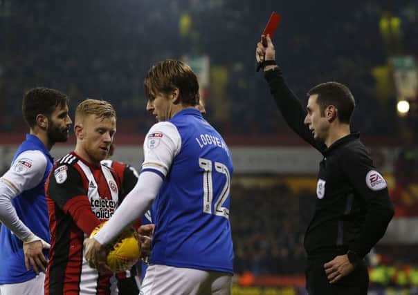 Sheffield Wednesday's Glenn Loovens is shown a red card against Sheffield United after a second cautionable offence (Pictures: Simon Bellis/Sportimage).