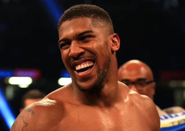 Anthony Joshua will fight Joseph Parker in Cardiff in March.