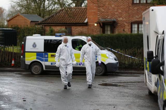 Police forensic officers leave the homes of suspect Anthony Lawrence, 55, and victim Shane Gilmer, 30.