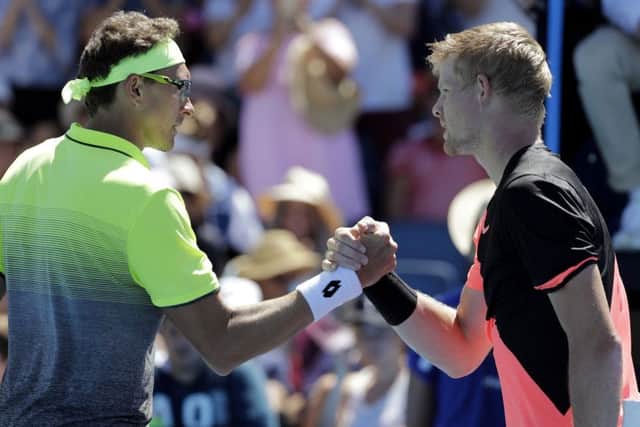 Britain's Kyle Edmund, right, is congratulated by Uzbekistan's Denis Istomin after winning his second round match at the Australian Open.