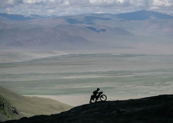 Ben Page on an uphill push in Mongolia.