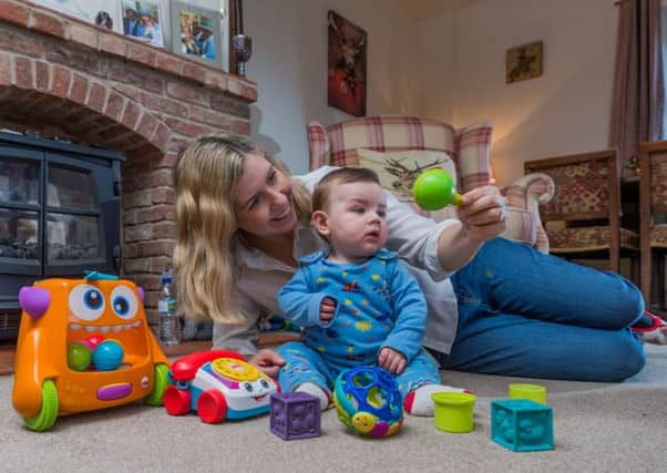 Date: 3rd January 2018.
Picture James Hardisty.
Andrea Jenkyns, Conservative Member of Parliament for Morley and Outwood, at home in Gildersome, with her baby boy Clifford, aged 9 months.