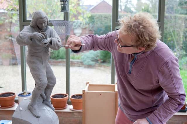 Artist Marcus Cornish puts the finishing touches to a maquette of his sculpture of John Harrison. Plans have been revelaed for a full sized version to stand in the inventor's home town of Barrow upon Humber.