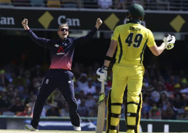 England's Joe Root, left, celebrates after getting the wicket of Australia's Steve Smith. (AP Photo/Tertius Pickard)