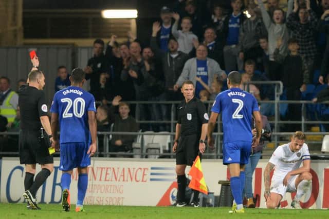 ON YOUR WAY: Referee Kevin Friend shows Liam Cooper the red card in the defeat at Cardiff City.  Picture: Bruce Rollinson