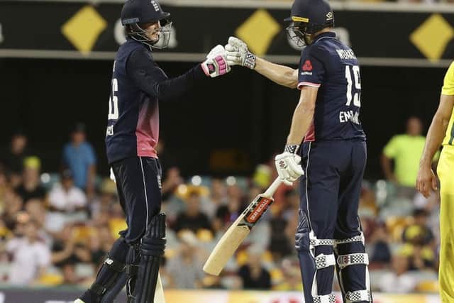 NICE ONE: England's Joe Root, left, and Chris Woakes, right, celebrate after beating Australia in BrisbaneAP Photo/Tertius Pickard)